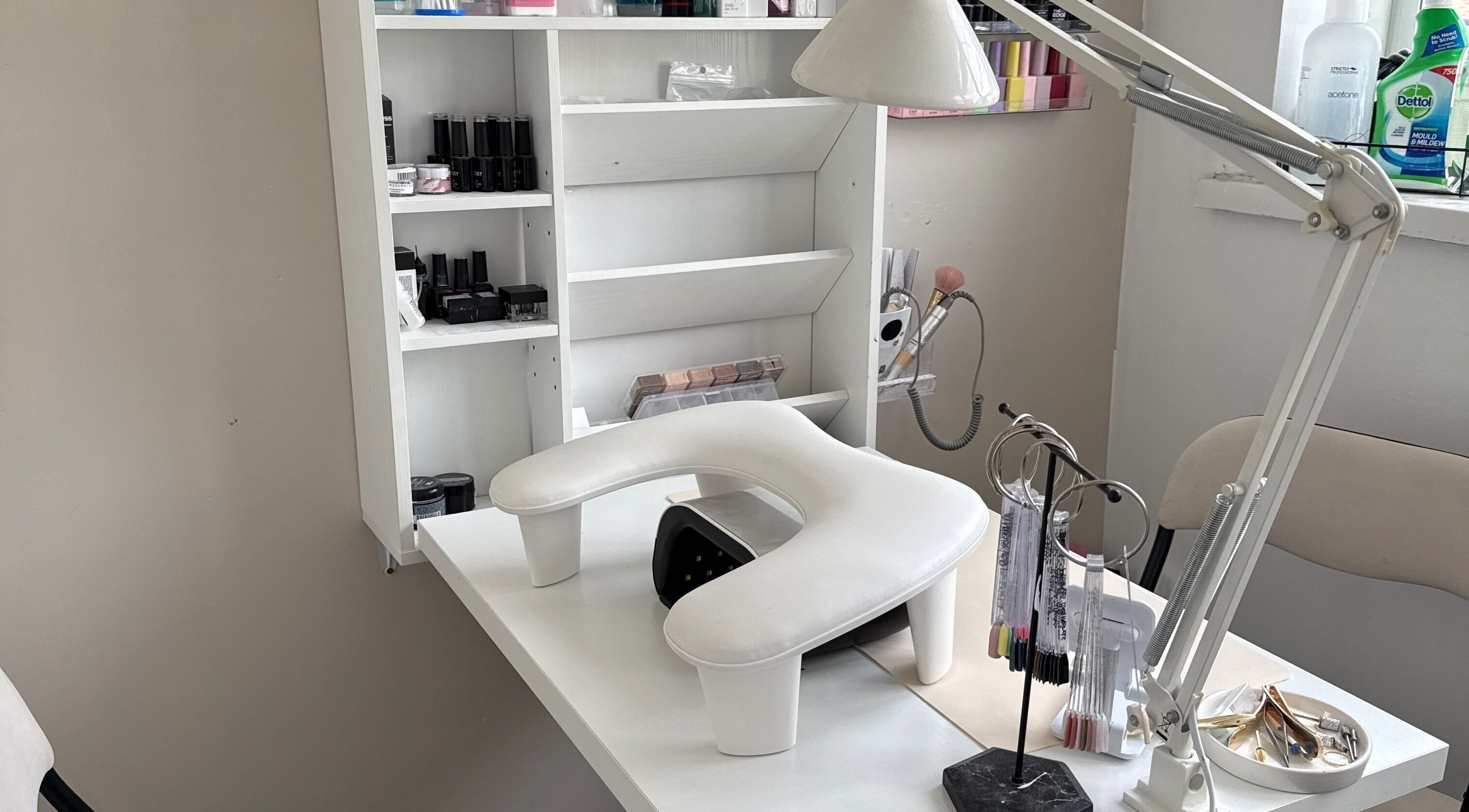 Bright nail salon workspace at Gels By Ells, Bilston, England, GB, showcasing elegant manicure tools and products.