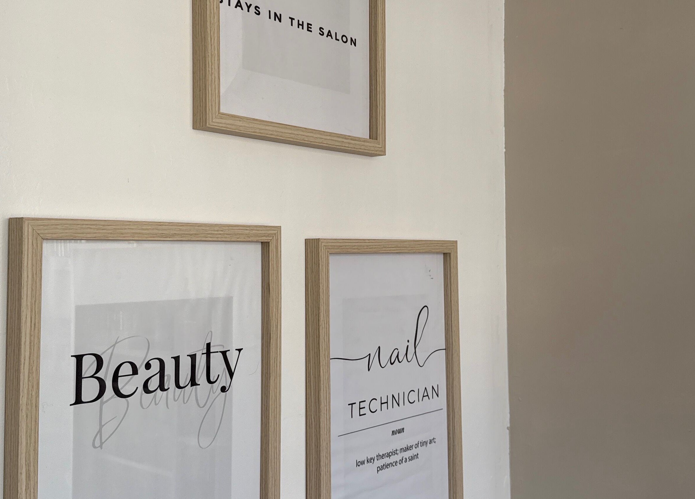Framed beauty-themed posters in Gels By Ells, Bilston, England, GB salon.
