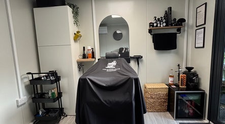 Elegant interior of The Barber Chair By Michael in Wainscott, England, GB with modern styling tools.