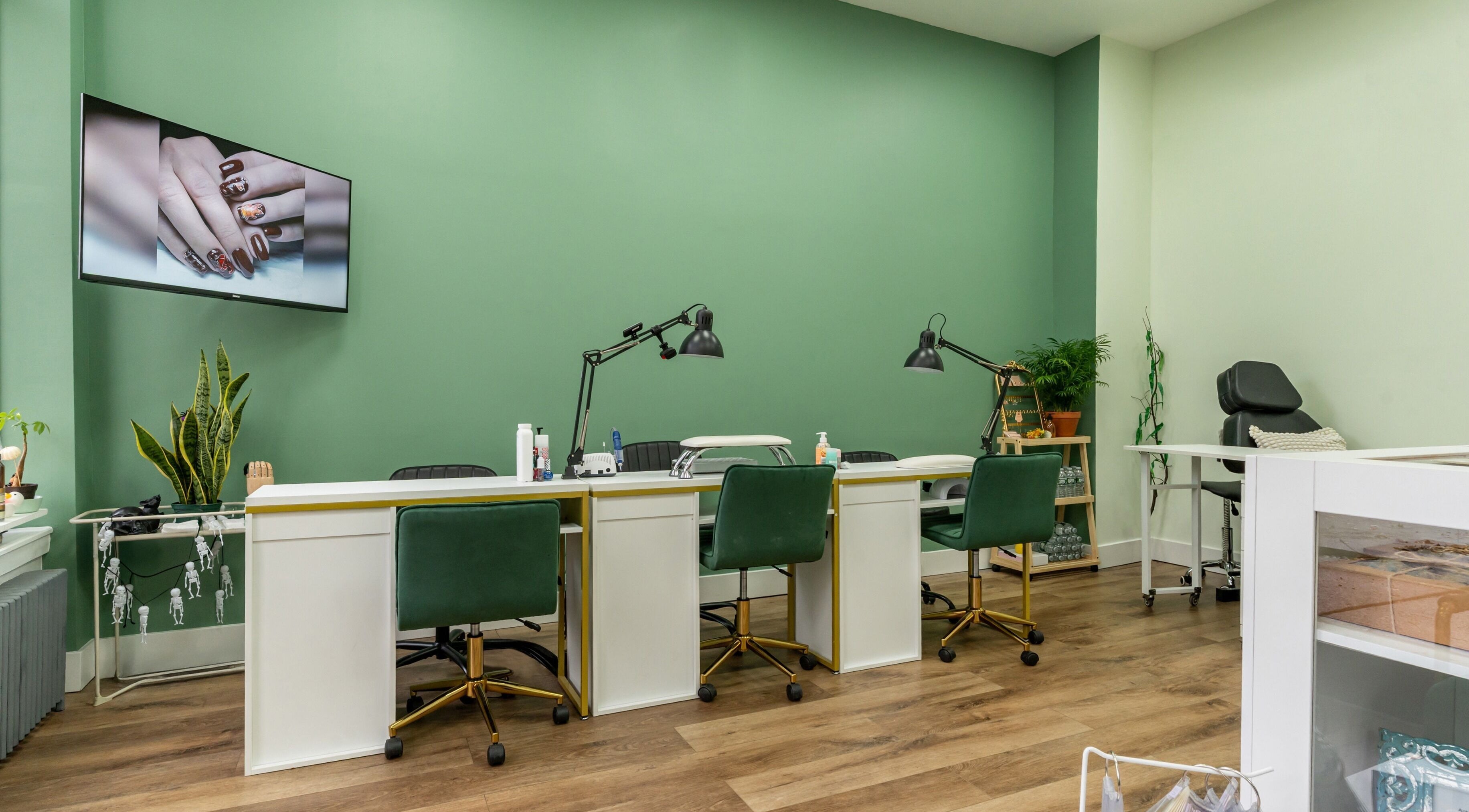 Modern mani station at Mani Aura - Russian Manicure in New York, New York, US with green decor.