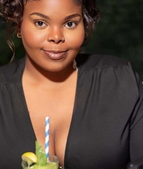 Woman enjoying a refreshing drink at Flawless finish by tashii, Kingston, St. Andrew Parish, JM.