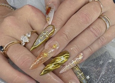 Intricate golden nail art at Vien Beauty Badham in Dickson, Australian Capital Territory, AU.