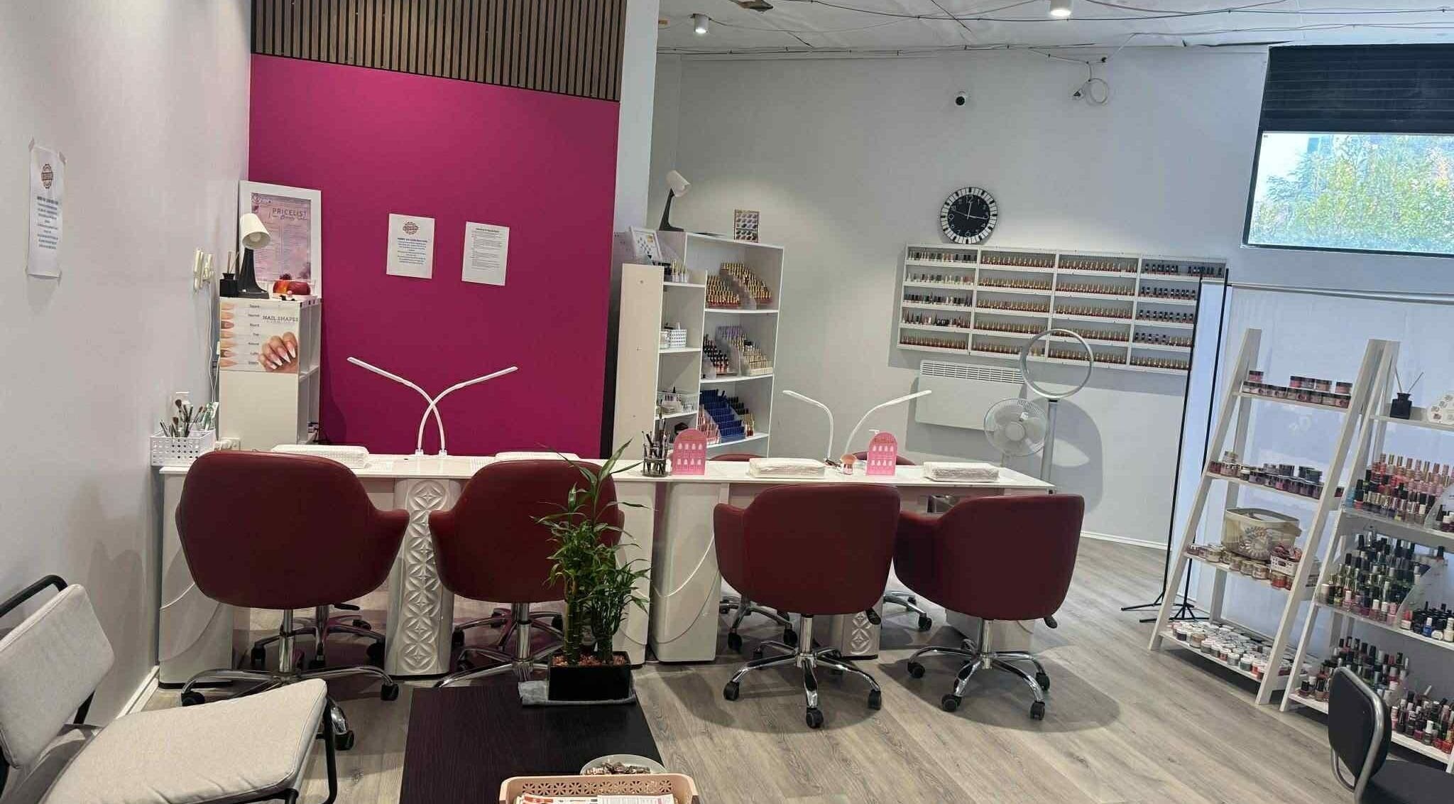 Modern nail salon at Vien Beauty Braddon, Braddon, Australian Capital Territory, AU with stylish red chairs.