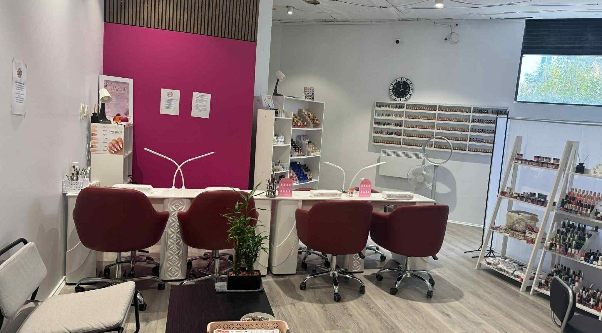 Modern nail salon at Vien Beauty Braddon, Braddon, Australian Capital Territory, AU with stylish red chairs.