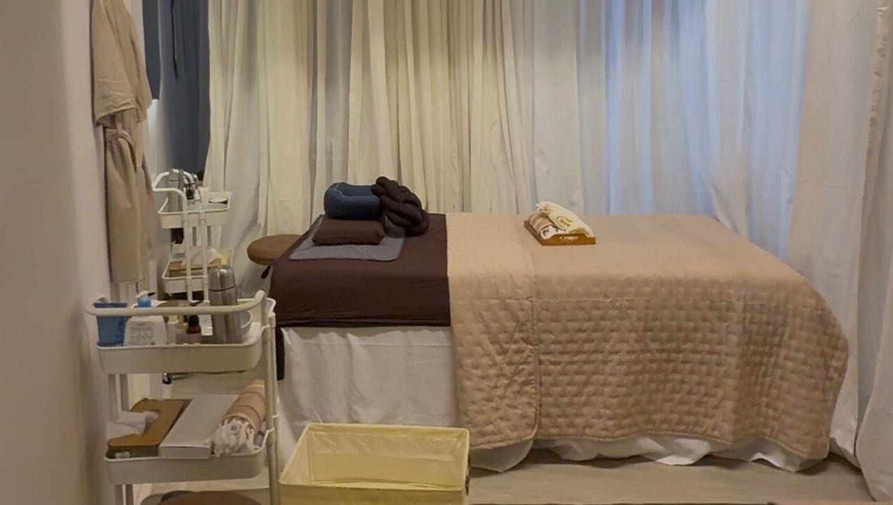 Relaxing treatment room at Luminee Spa in Bali, Bali, ID featuring a plush massage table and calming decor.