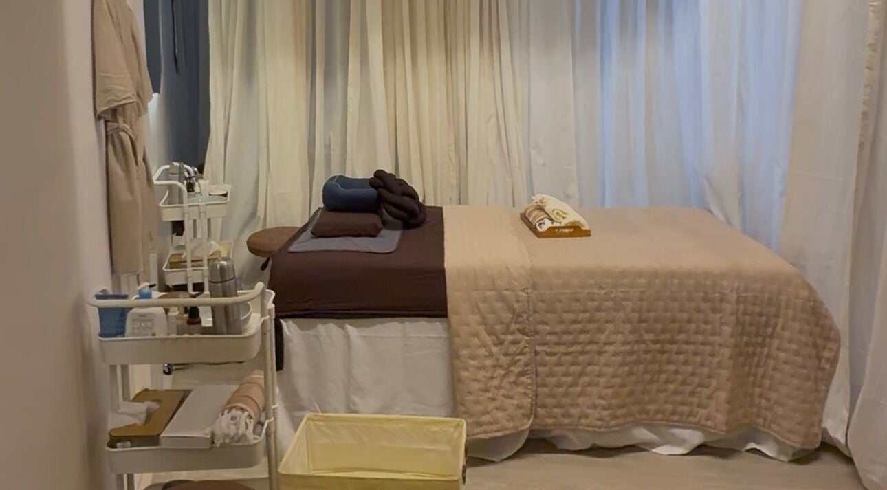 Relaxing treatment room at Luminee Spa in Bali, Bali, ID featuring a plush massage table and calming decor.