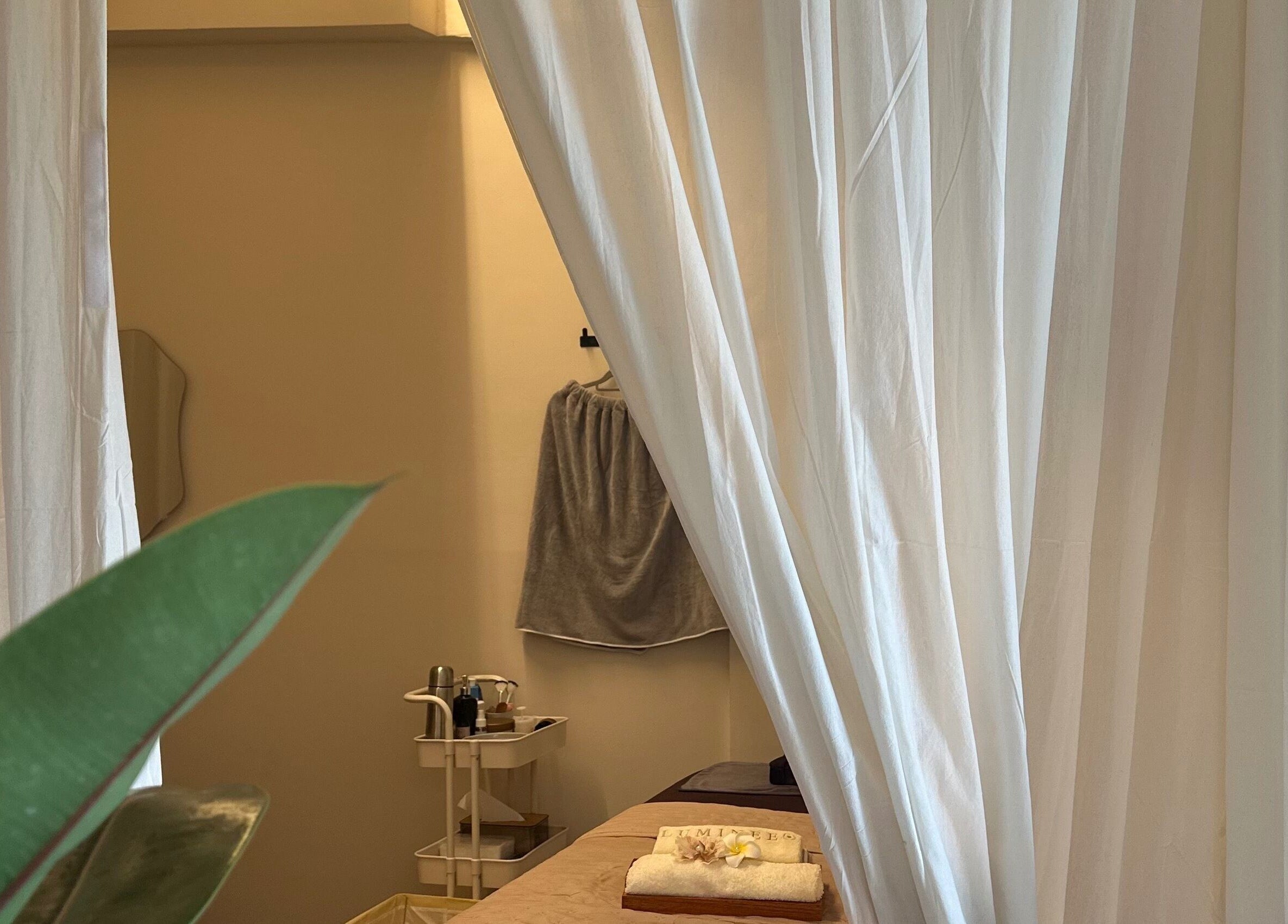 Tranquil massage room with curtains at Luminee Spa, Bali, Bali, ID for optimal relaxation.