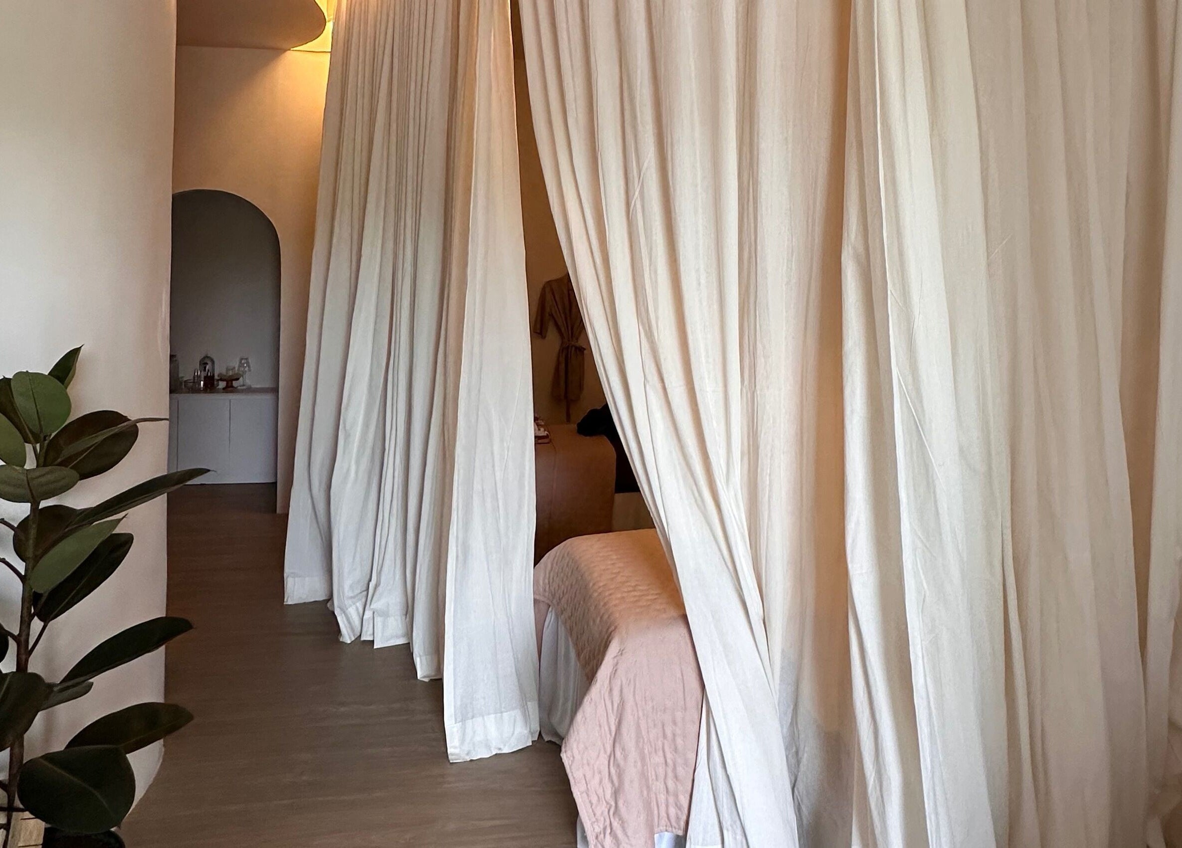 Relaxing treatment room with curtains at Luminee Spa, Bali, Bali, ID. Calm ambiance enhances spa experience.