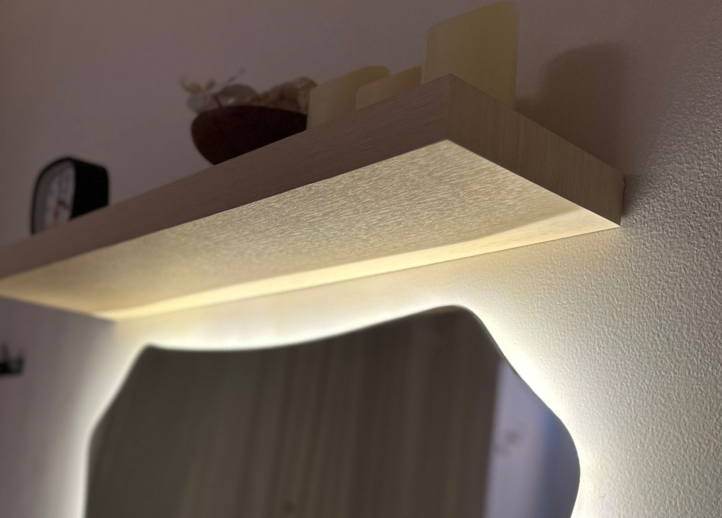 Elegant wall shelf with warm lighting at Luminee Spa, Bali, Bali, ID, enhancing relaxation ambiance.