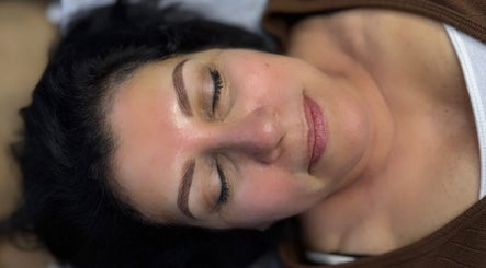 Relaxed woman enjoying a facial treatment at Studio DCV by Diana in La Crescenta-montrose, California, US.