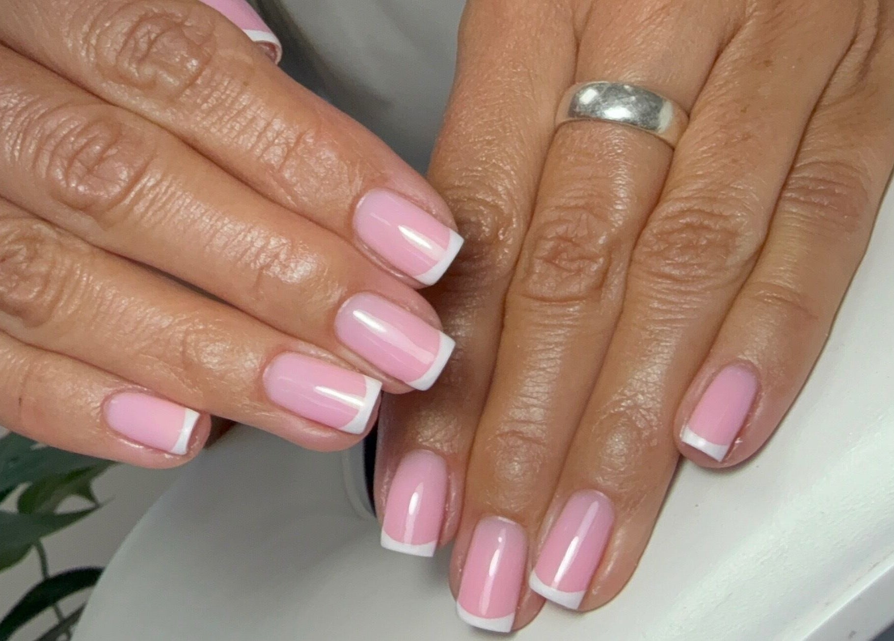 Elegant French manicure at Left & Right Beauty, Colchester, England, GB, showcasing pink and white nail design.