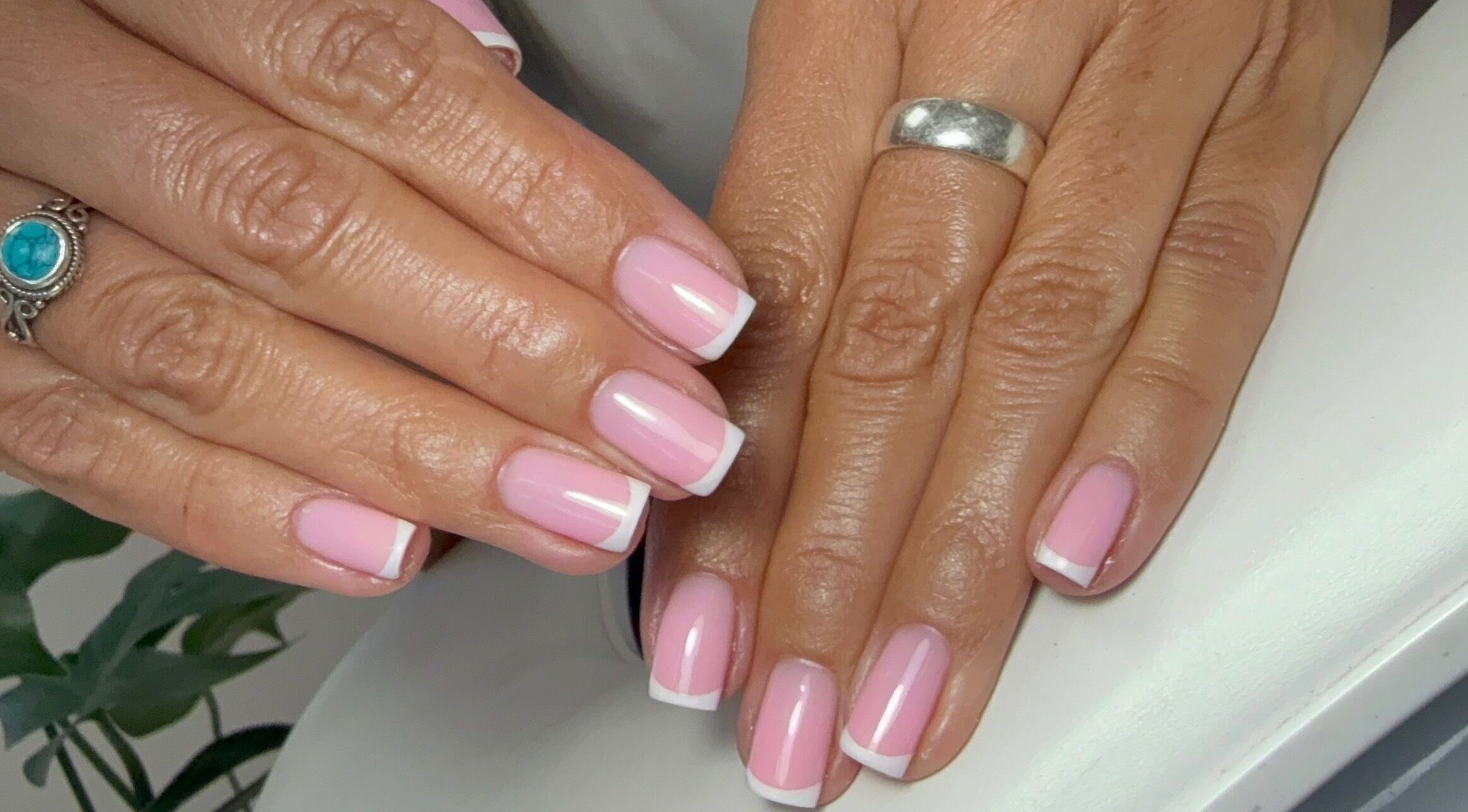 Elegant French manicure at Left & Right Beauty, Colchester, England, GB, showcasing pink and white nail design.