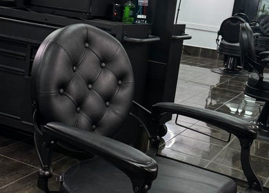 Luxurious barber chair at Collective Vision Barbers, Gladstone Central, Queensland, AU featuring modern decor.