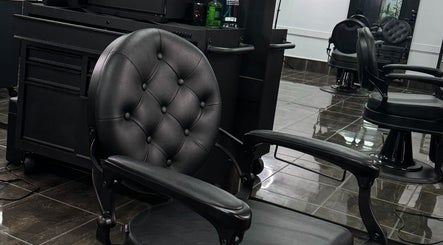 Luxurious barber chair at Collective Vision Barbers, Gladstone Central, Queensland, AU featuring modern decor.