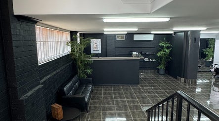 Reception and waiting area at Collective Vision Barbers in Gladstone Central, Queensland, AU, featuring modern decor.