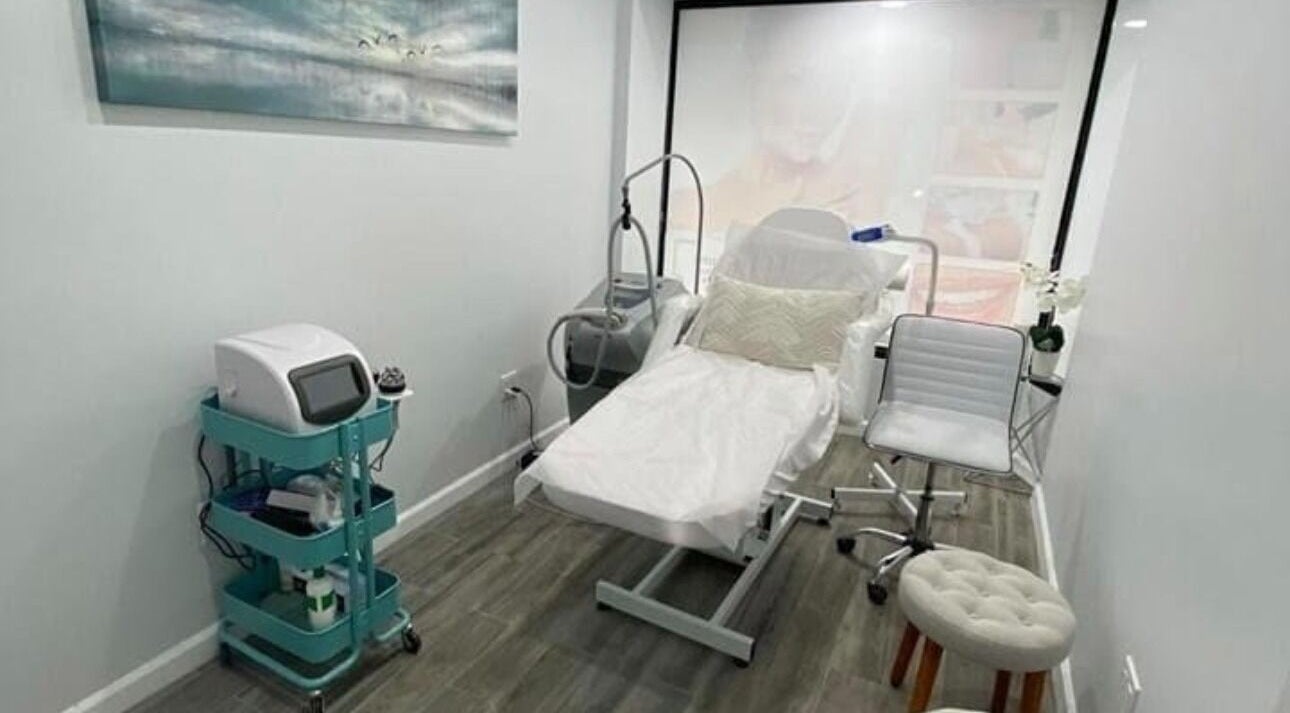 Modern treatment room at Aesthetika NYC in New York, New York, US featuring a reclining chair and beauty equipment.