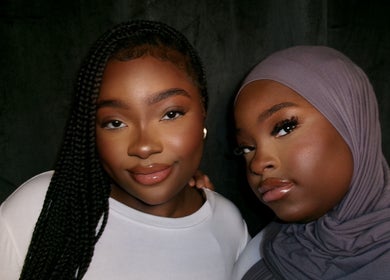 Two women smiling, showcasing beauty at The Twins Lounge, Montréal, Québec, CA.