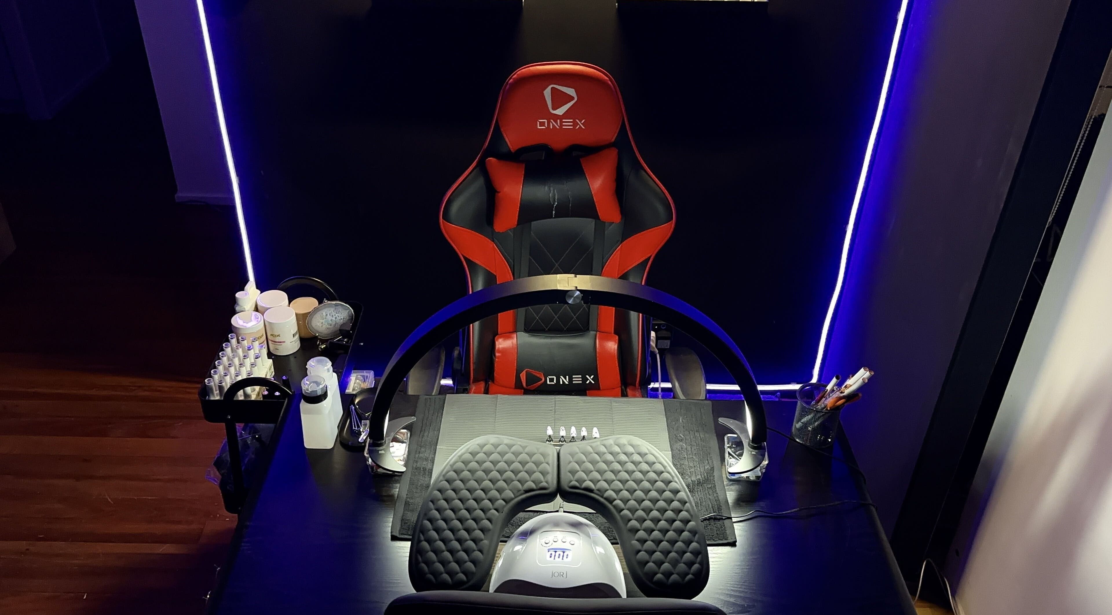 Modern nail station with gaming chair at Dark Star Nail Bar, Goonellabah, New South Wales, AU.