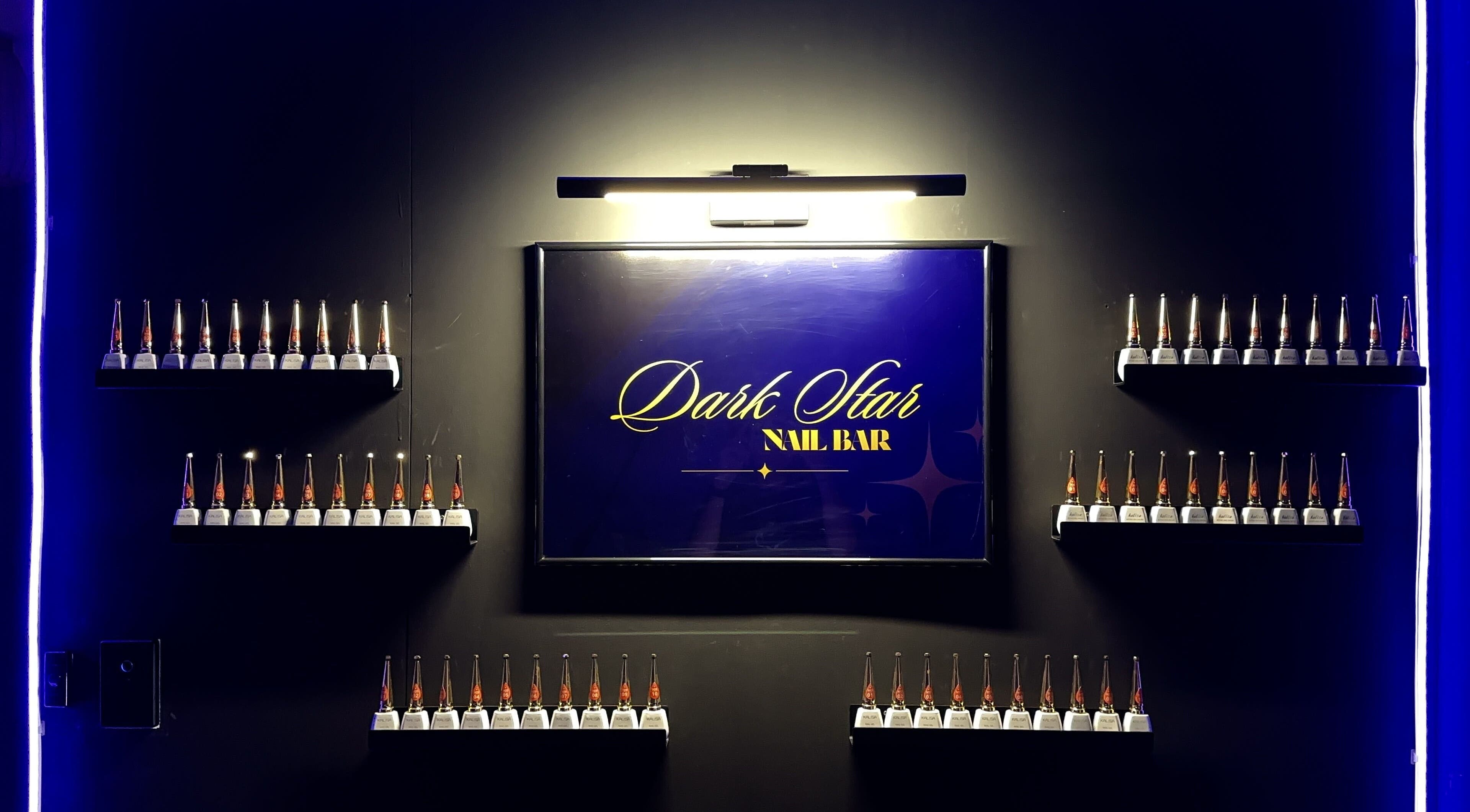 Interior display at Dark Star Nail Bar in Goonellabah, New South Wales, AU, featuring stylish nail polish bottles.