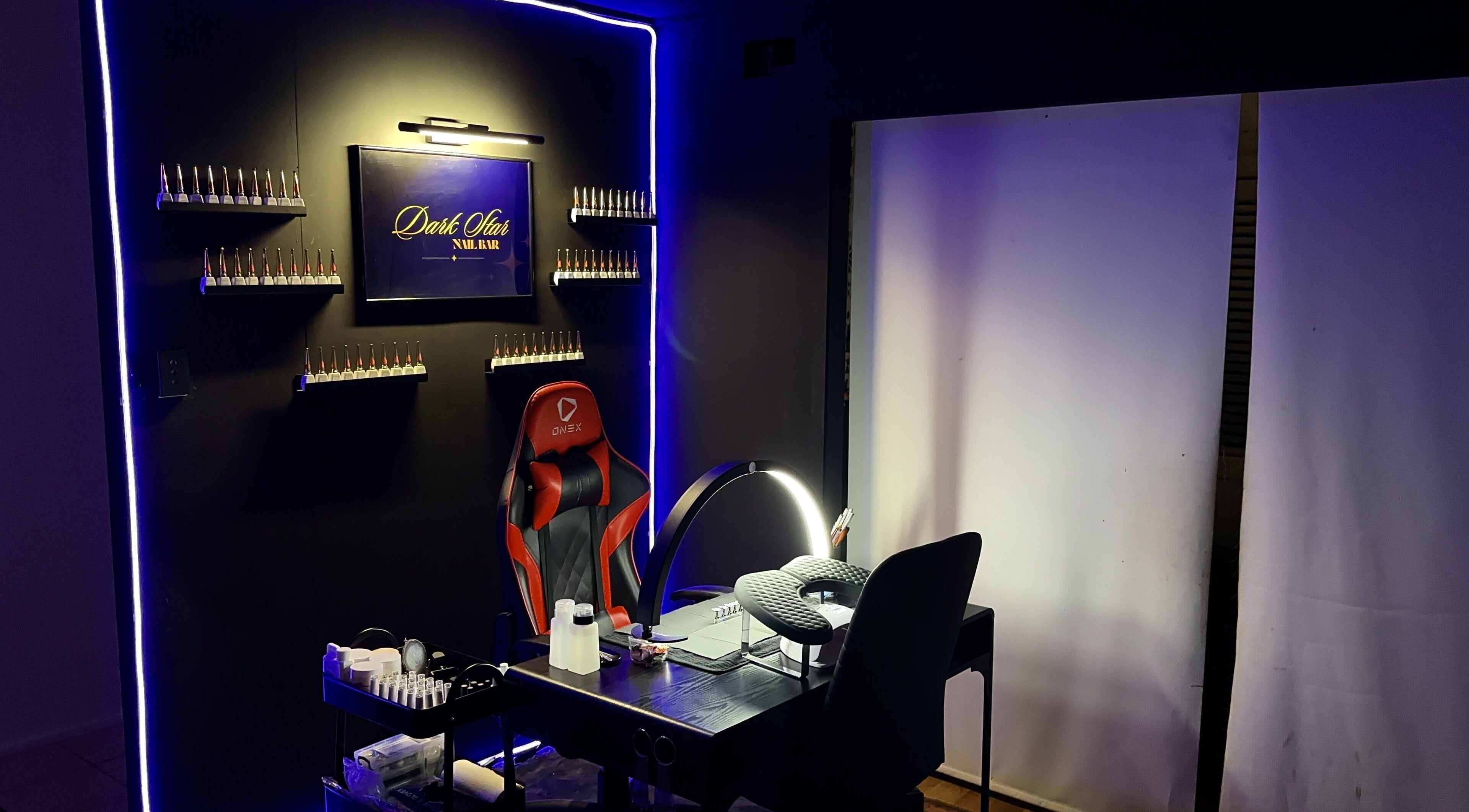 Modern nail station at Dark Star Nail Bar, Goonellabah, New South Wales, AU, with stylish lighting and seating.