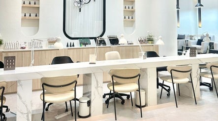 Modern interior at Peony Beauty Center Kalba featuring sleek workstations in Kalba, Sharjah, AE.