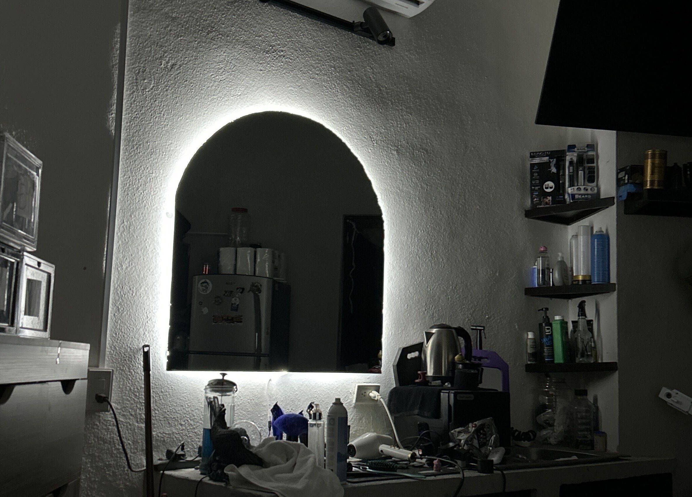 A stylish barber station at L’Hommebarbershopp, Cabo San Lucas, Baja California Sur, MX, with various grooming tools.