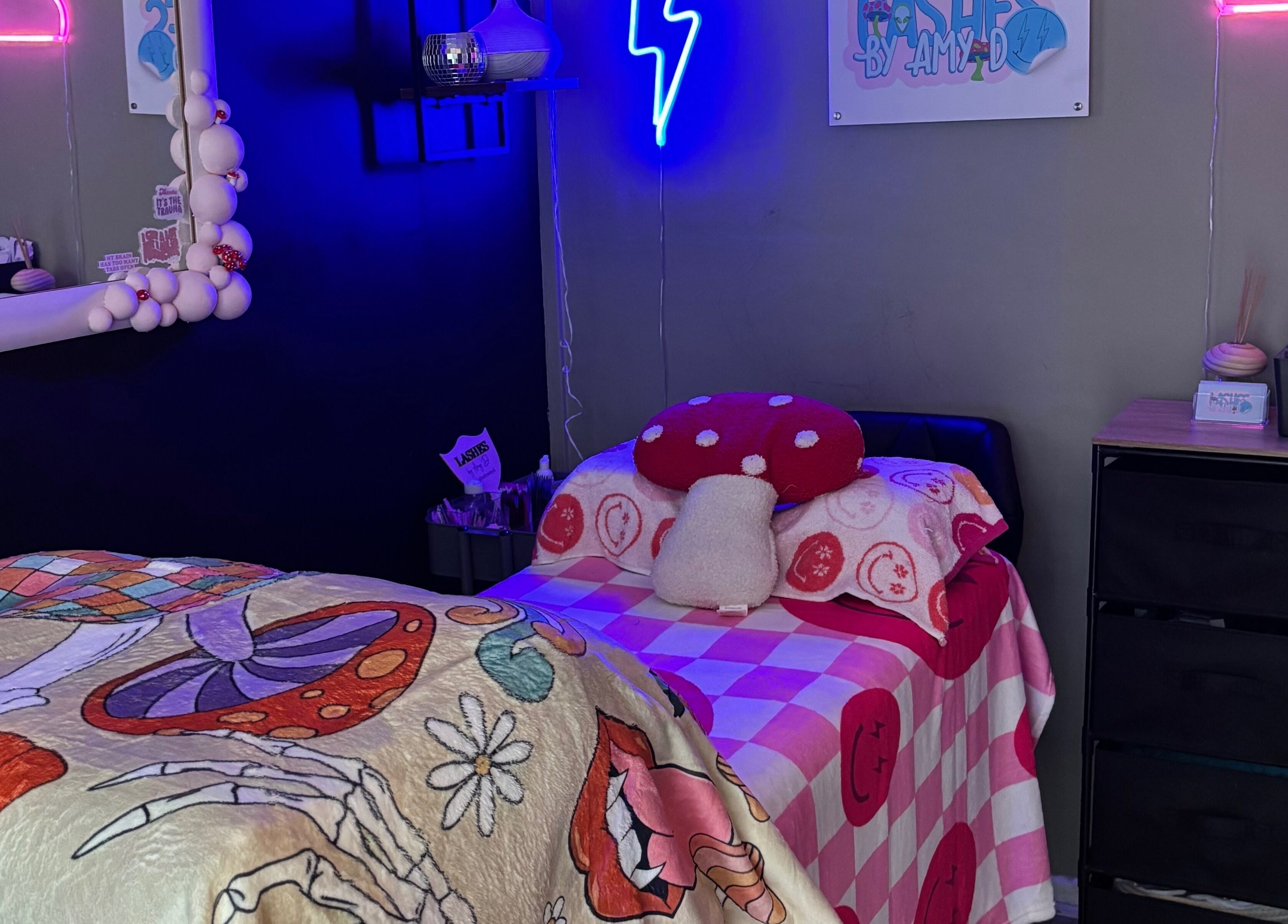 Inviting treatment room at Lashes By Amy.D in Runcorn, England, GB with vibrant decor and neon lights.