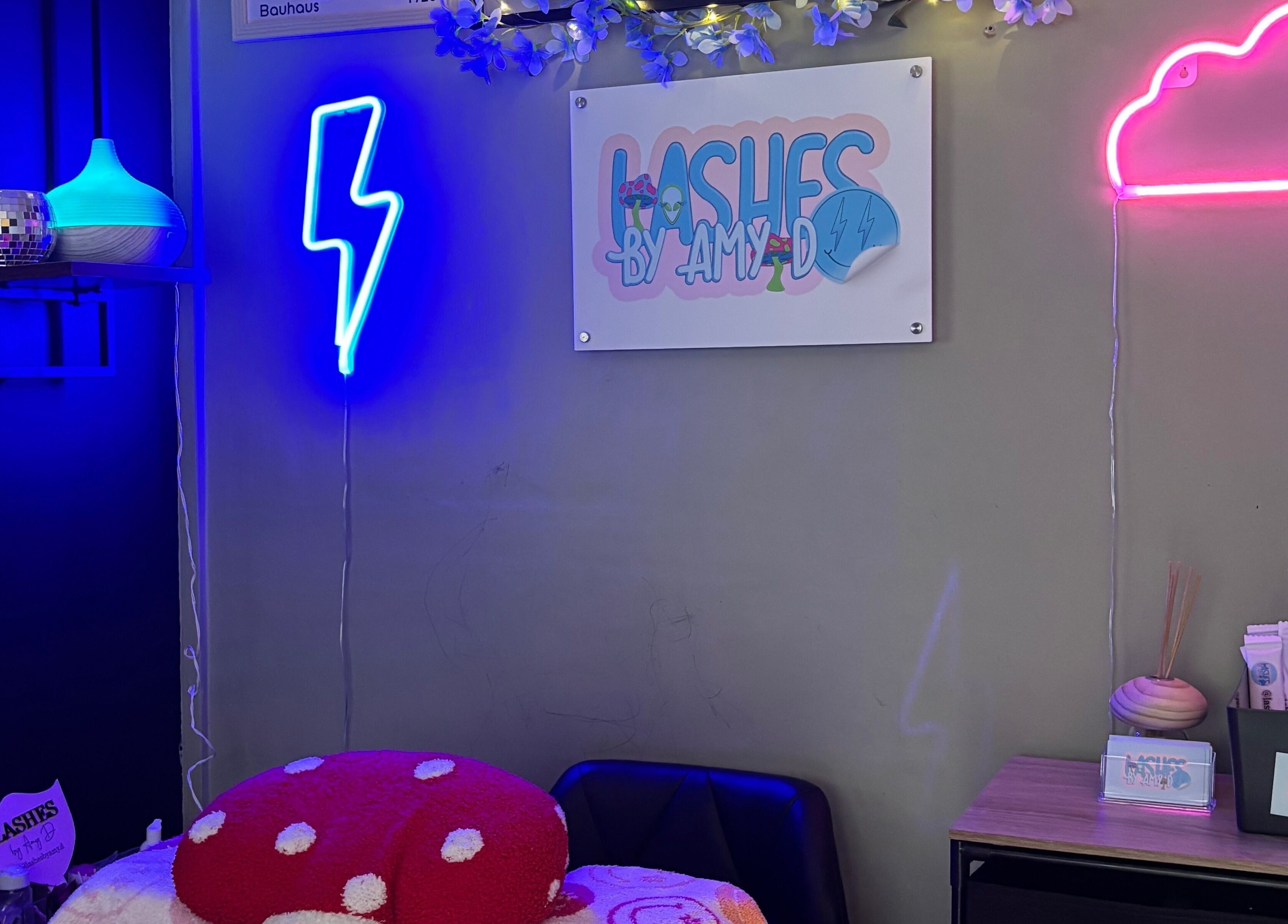Vibrant neon lights at Lashes By Amy.D, Runcorn, England, GB, creating a welcoming beauty atmosphere.