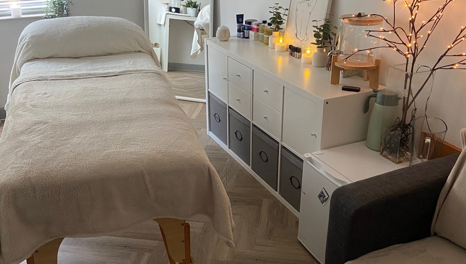 Tranquil massage room at Massage by Lucie in Northwich, England, GB with soft lighting and soothing decor.