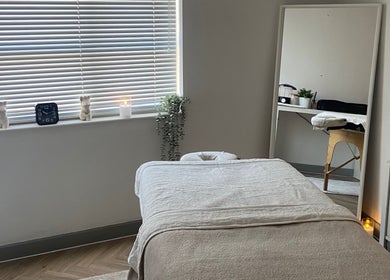 Tranquil massage room at Massage by Lucie, Northwich, England, GB with a cozy table and calming decor.