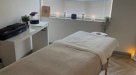 Peaceful massage room at Massage by Lucie, Northwich, England, GB with a cozy table and ambient lighting.