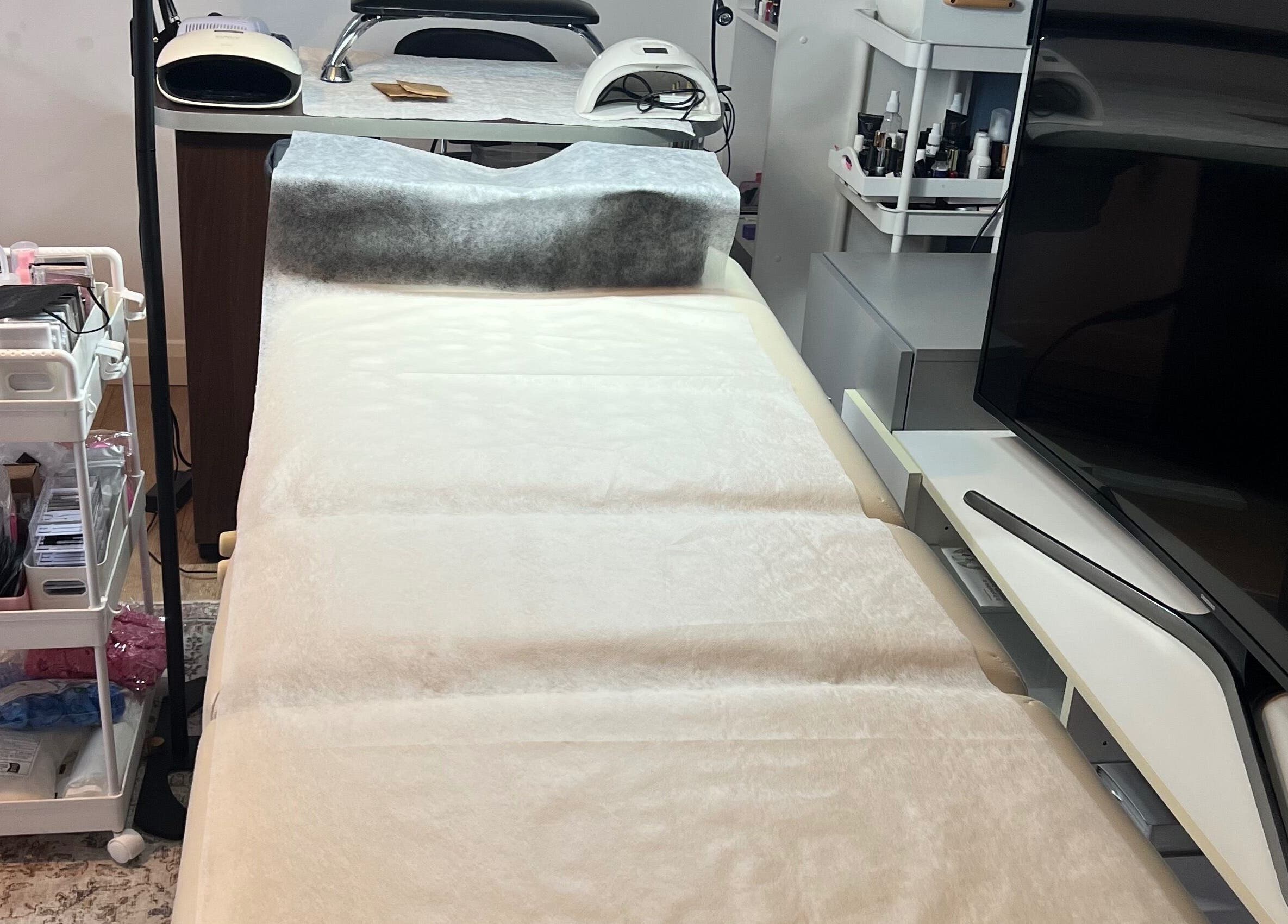 Comfortable treatment area at Nova Elle Beauty in Lutterworth, England, GB, showcasing professional equipment.