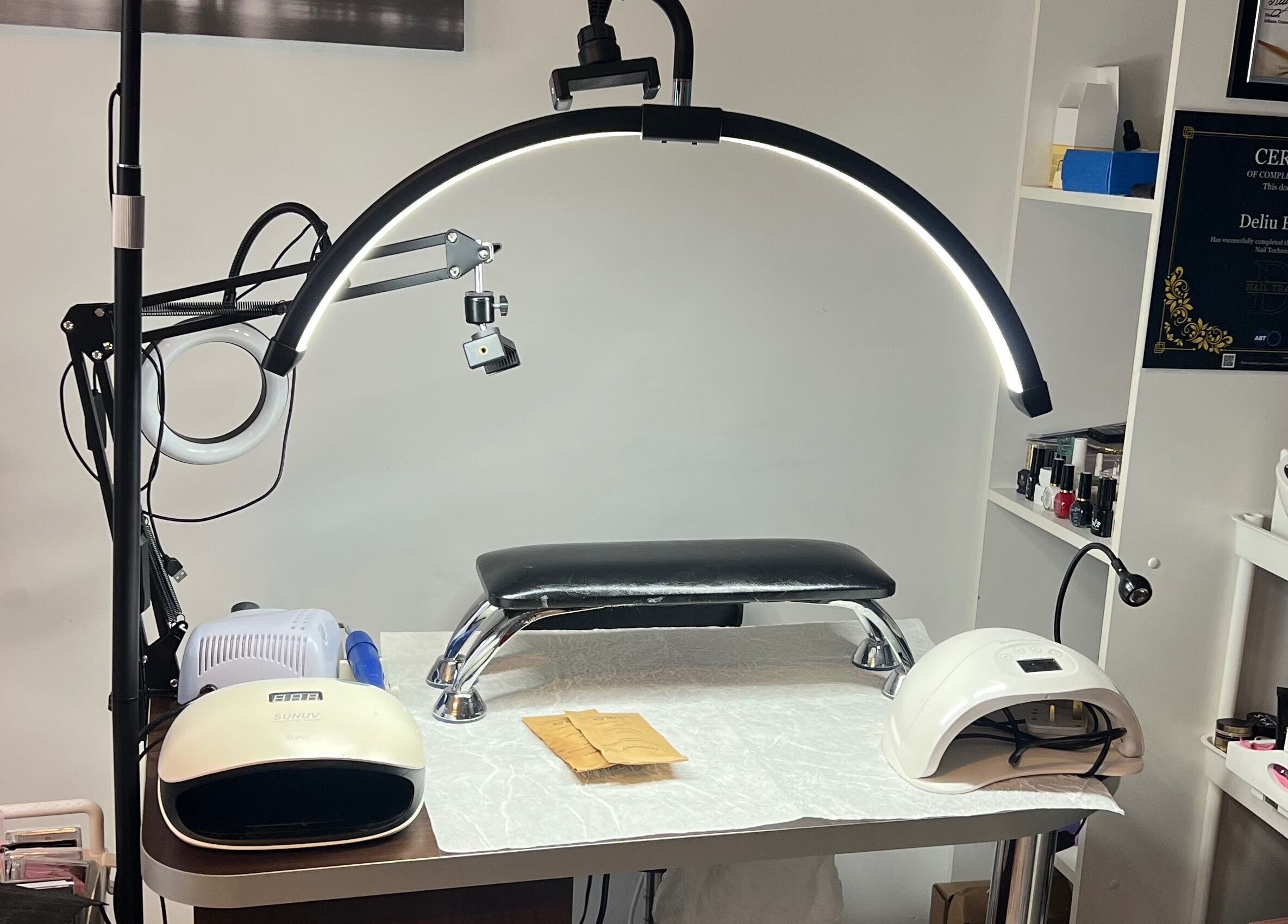 Nail station at Nova Elle Beauty, Lutterworth, England, GB with manicure tools and lamps.