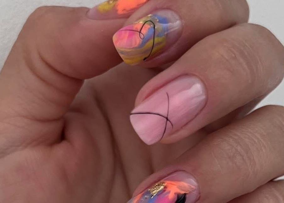 Colorful nail art at Nova Elle Beauty, Lutterworth, England, GB showcasing intricate designs.