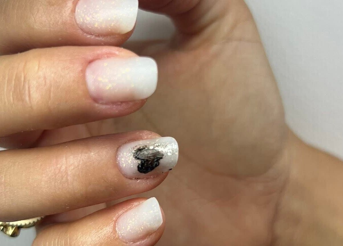 Elegant white nails with shimmer at Nova Elle Beauty, Lutterworth, England, GB.