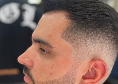 Fresh fade haircut at Cutsbyraff, Dublin, County Dublin, IE showcasing precision styling.