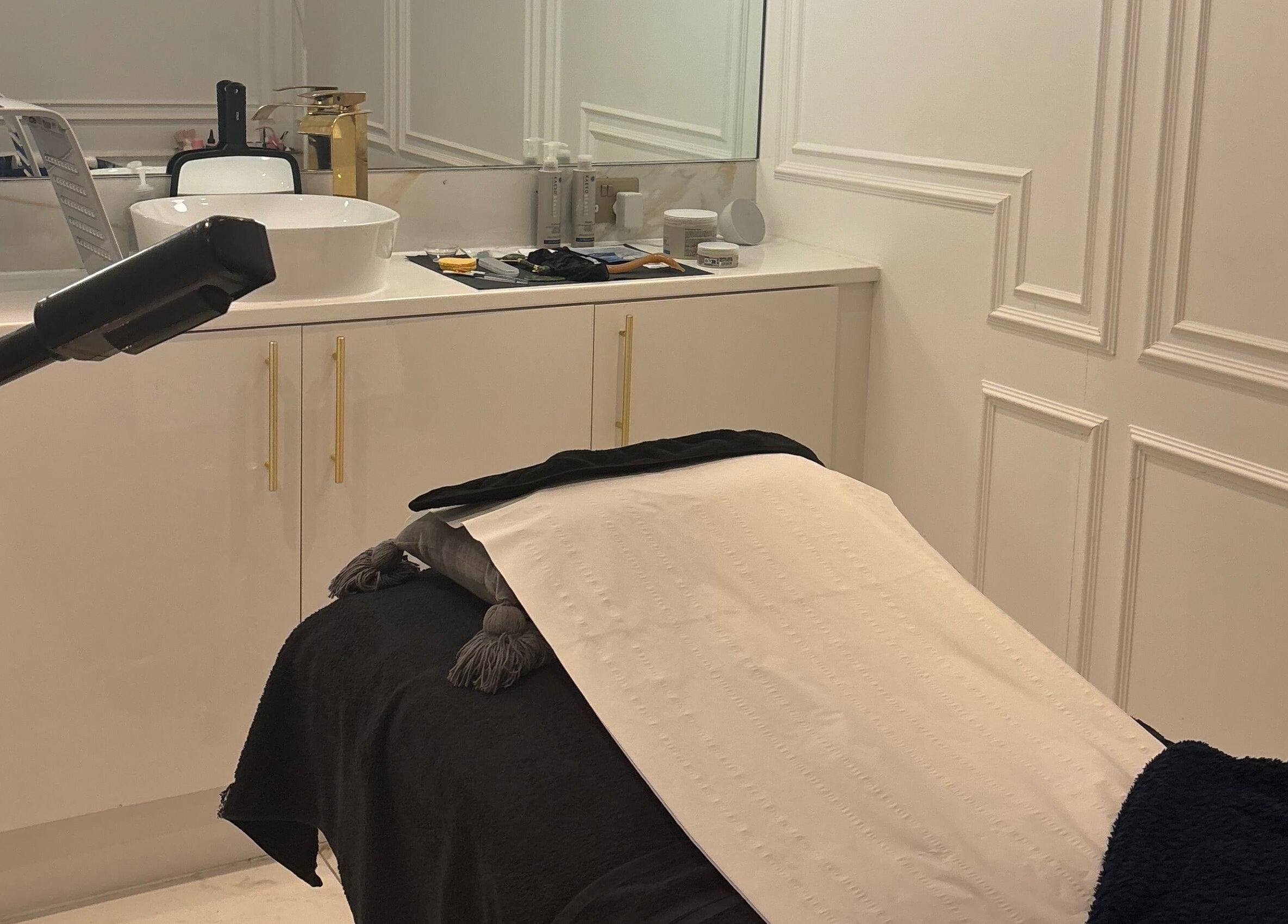 Elegant treatment room at By Chrissie Beauty, Bournemouth, England, GB with a sleek, modern design.