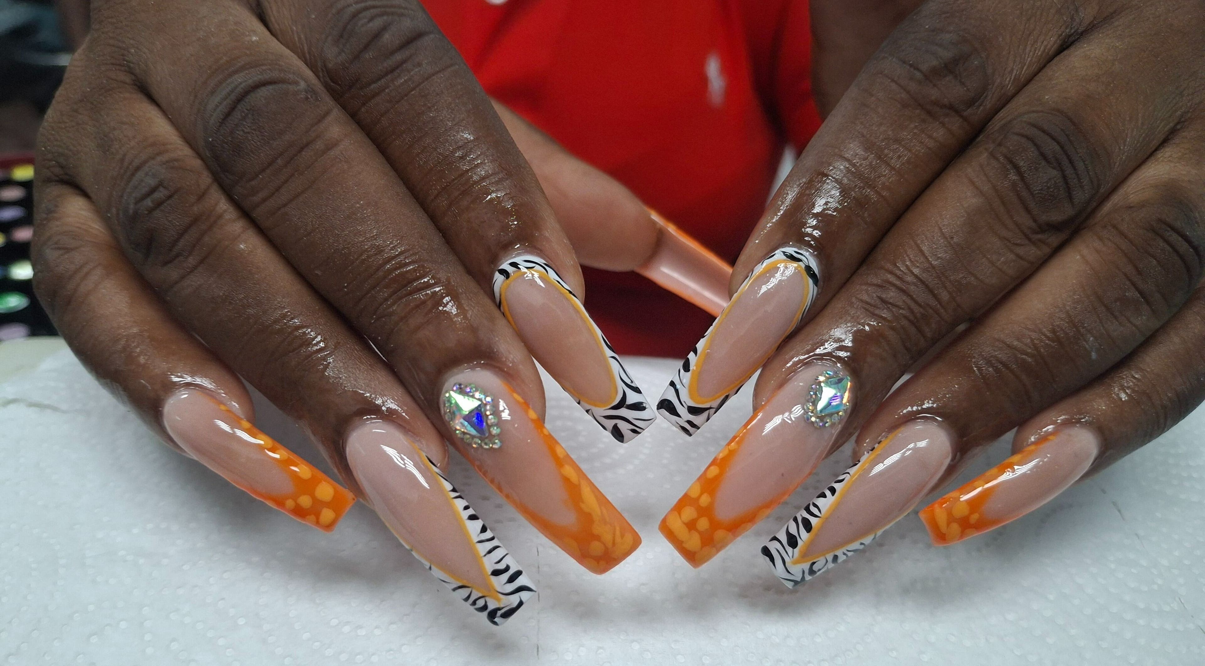 Stylish nail art design at Lisa Spa in Bridgetown, Saint Michael, BB. Vibrant colors and intricate patterns.