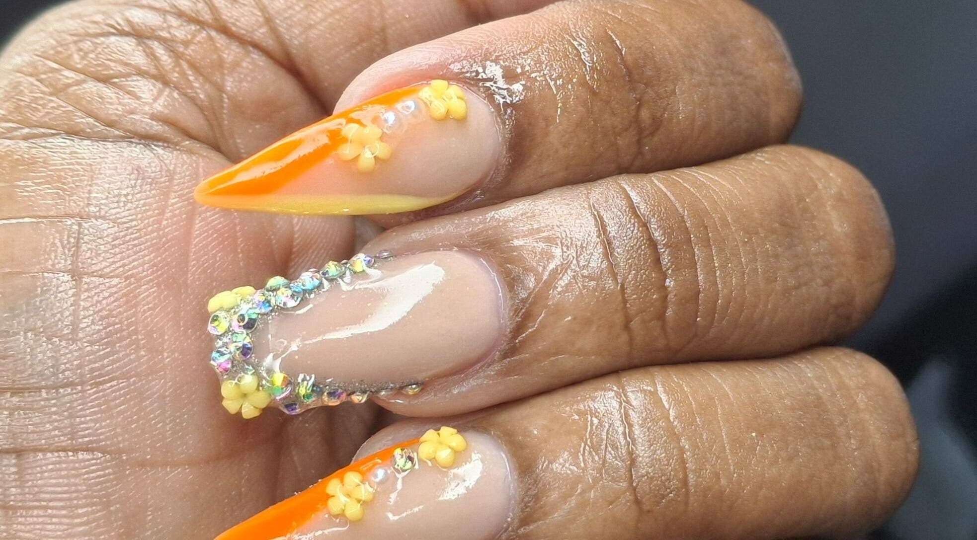 Bright orange and gem-embellished nails designed at Lisa Spa, Bridgetown, Saint Michael, BB.