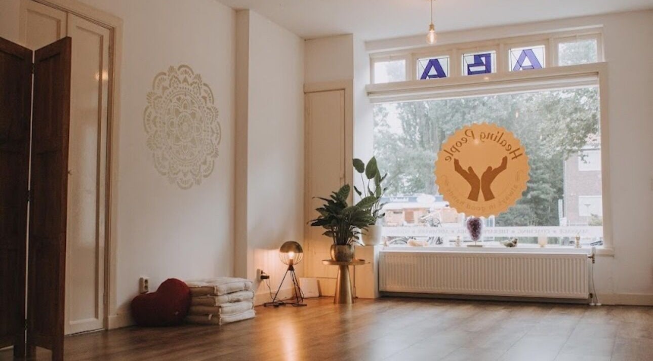 Tranquil room at Life Force Whispers - ILM treatments, Amsterdam, Noord-Holland, NL with soft lighting and plants.
