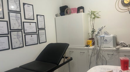Treatment room at Naz Aesthetics, Manchester, England, GB with certifications and advanced equipment.