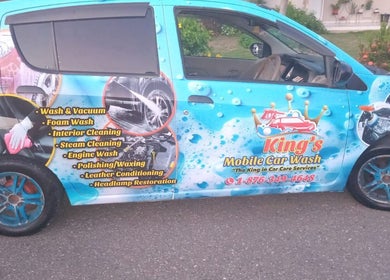 King's Mobile Carwash and Upholstery van with vibrant branding in JM offering premium wash and detailing services.