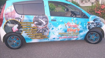 King's Mobile Carwash and Upholstery van with vibrant branding in JM offering premium wash and detailing services.