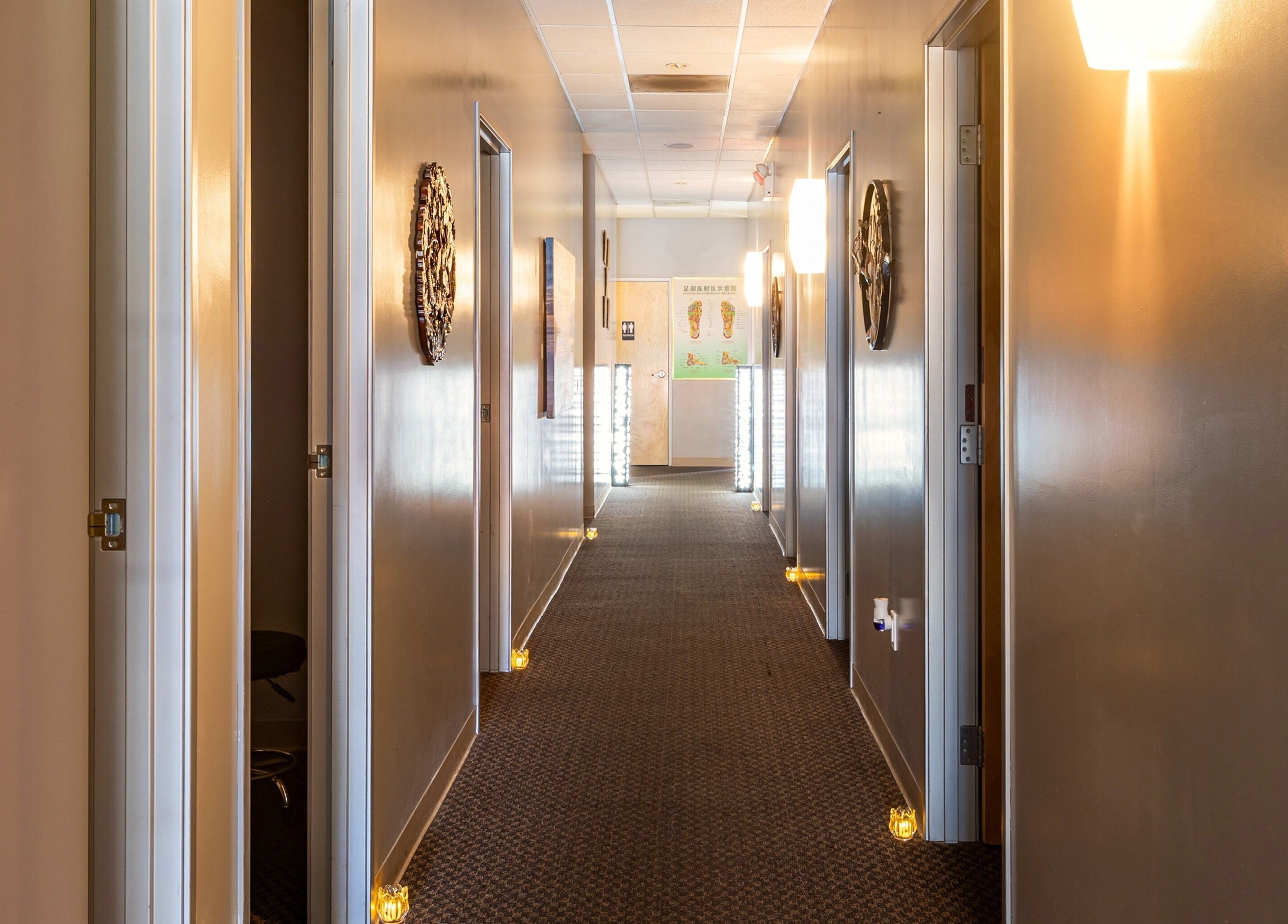 Tranquil hallway at Elation Massage & Spa - San Diego, California, US, warmly lit and inviting.