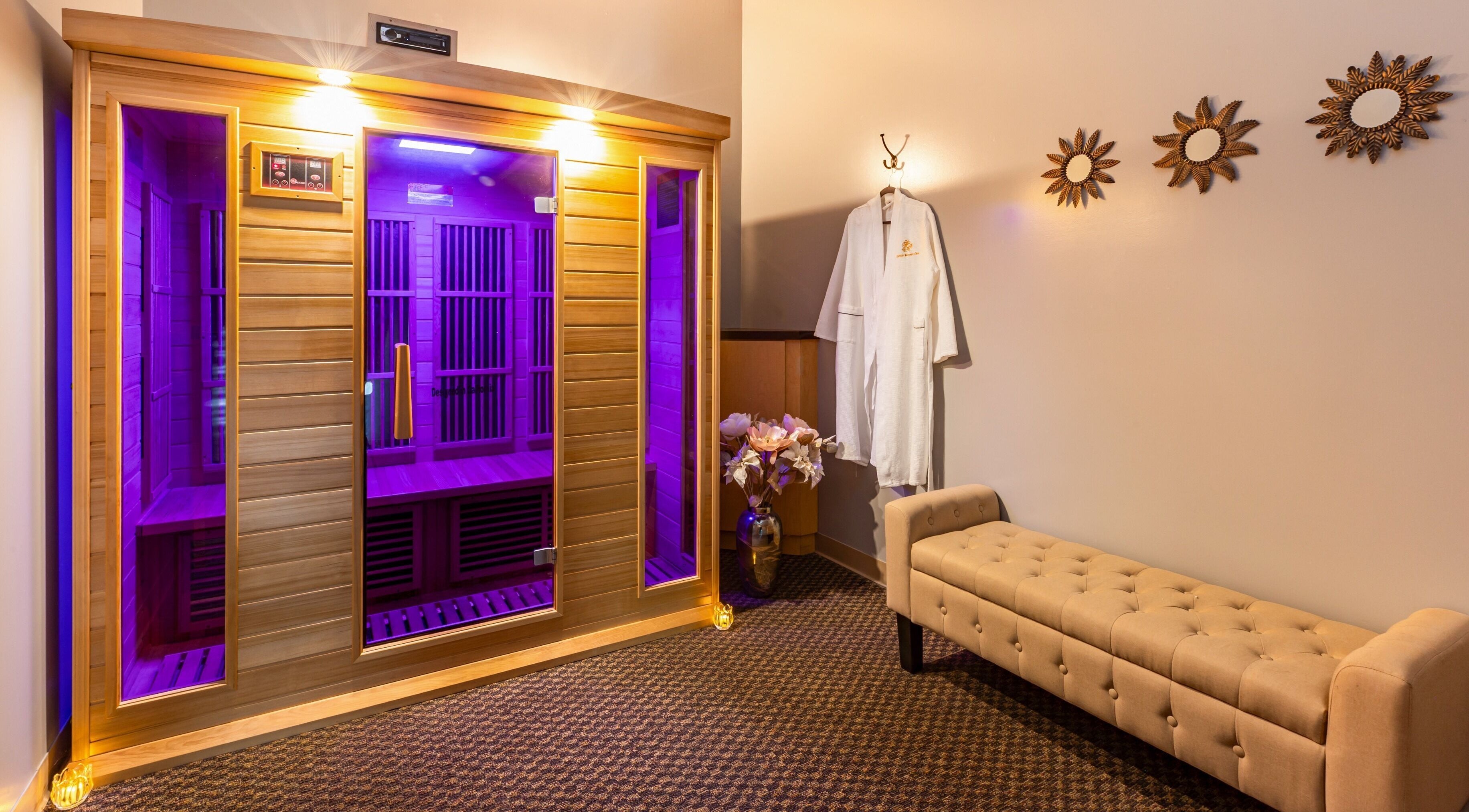 Relaxing sauna at Elation Massage & Spa - San Diego, California, US with purple lighting and elegant decor.