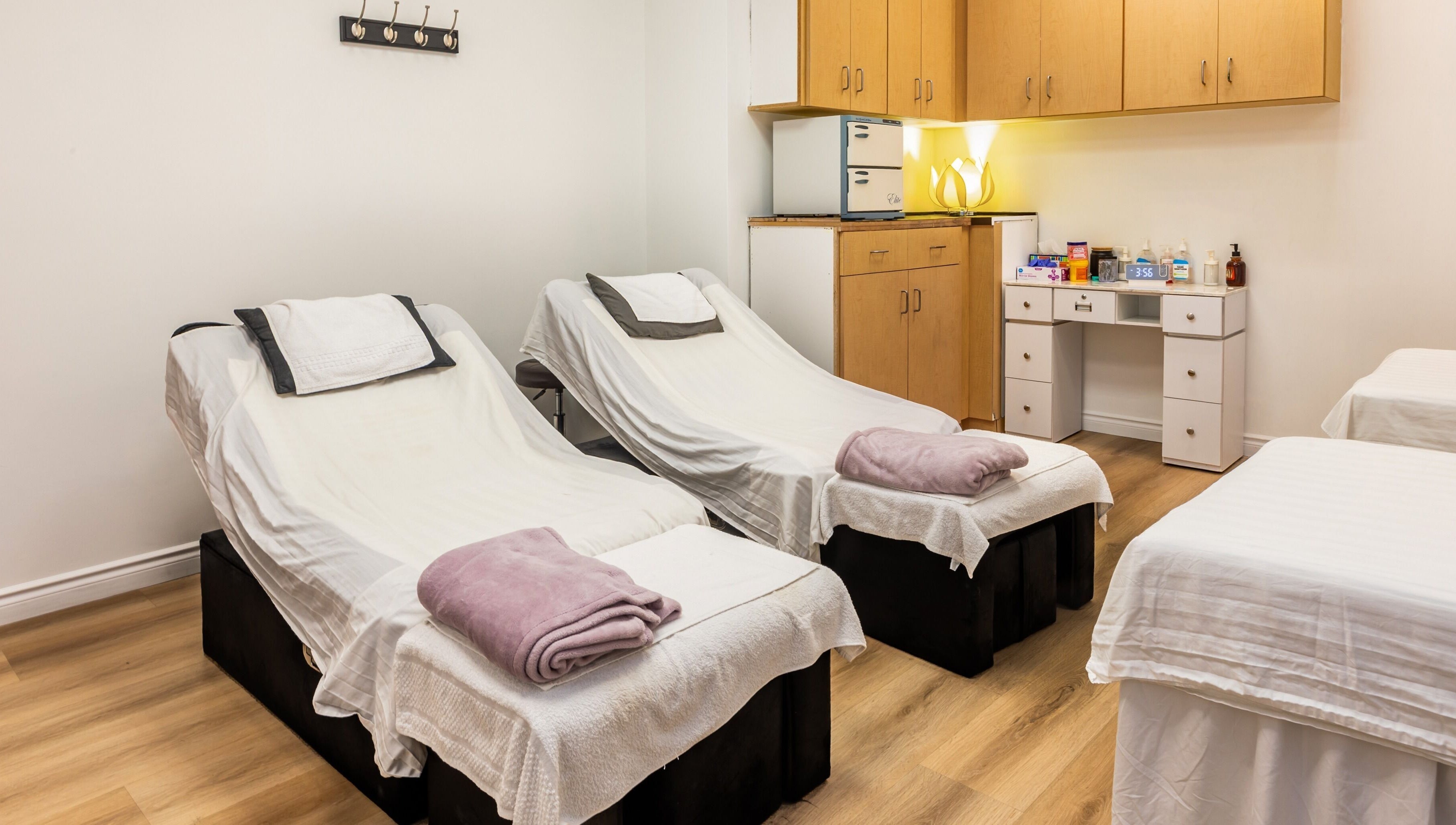 Relaxing treatment room at Elation Massage & Spa - San Diego, California, US, with massage beds and soft lighting.