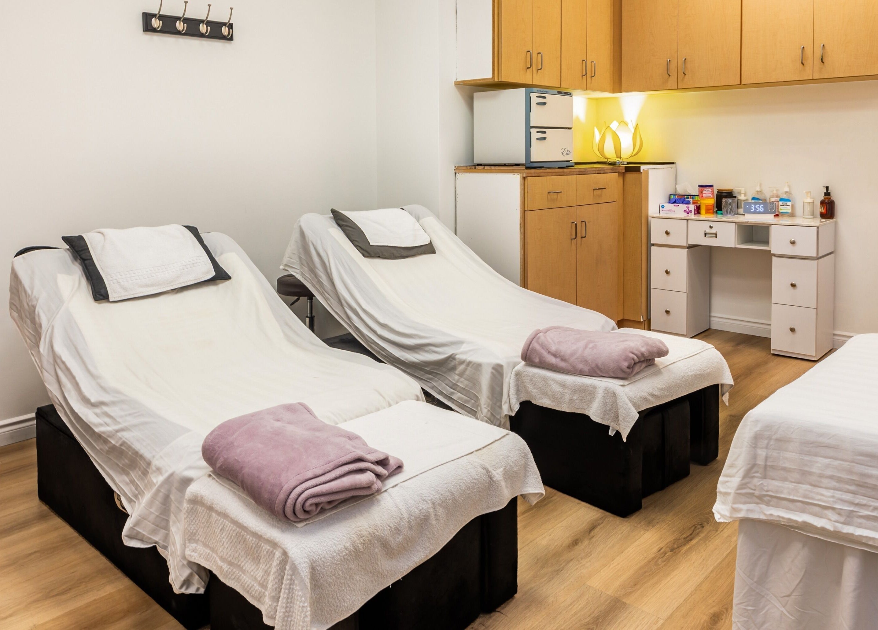 Relaxing treatment room at Elation Massage & Spa - San Diego, California, US, with massage beds and soft lighting.