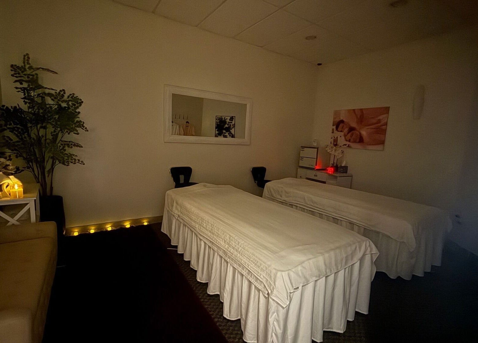 Relaxing massage room at Elation Massage & Spa - San Diego, featuring cozy beds and soft lighting, San Diego, California, US.