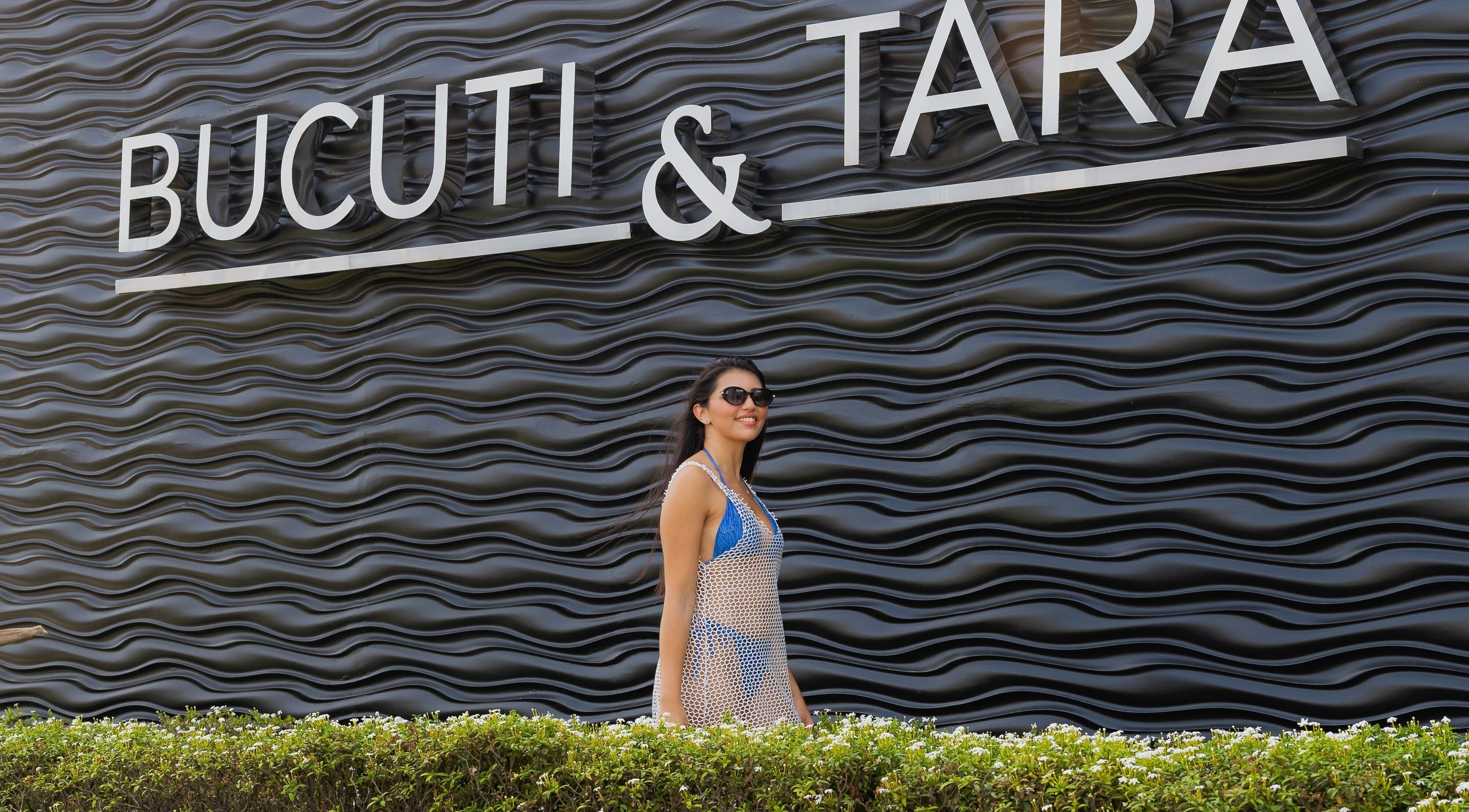 Visitor at Purun Spa's stylish exterior in Eagle, AW, near lush greenery.