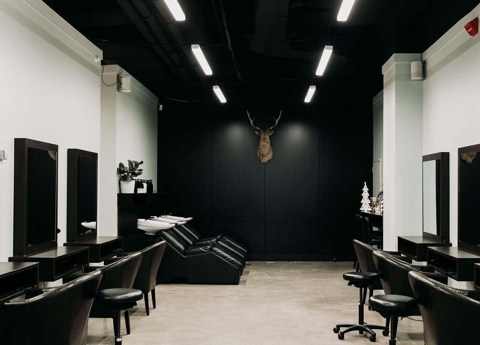 Modern salon interior with styling stations at Sable, Wellington, Wellington Region, NZ.